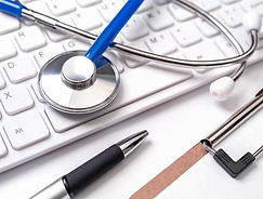 stethoscope-on-computer-keyboard-on-white-background-physician-write-medical-case-long-ter