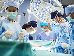 stock-photo-group-surgeons-operating-room.jpg